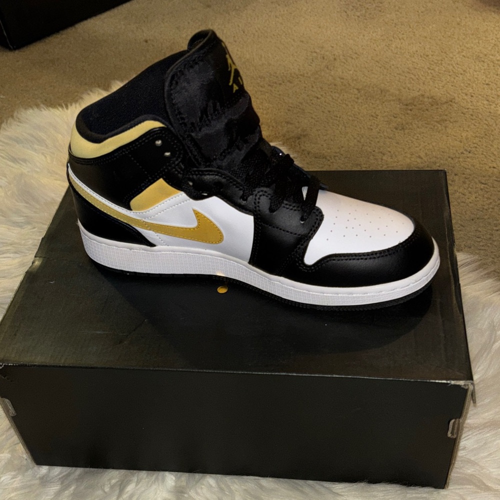 Jordan Black, White, and Gold Sneakers